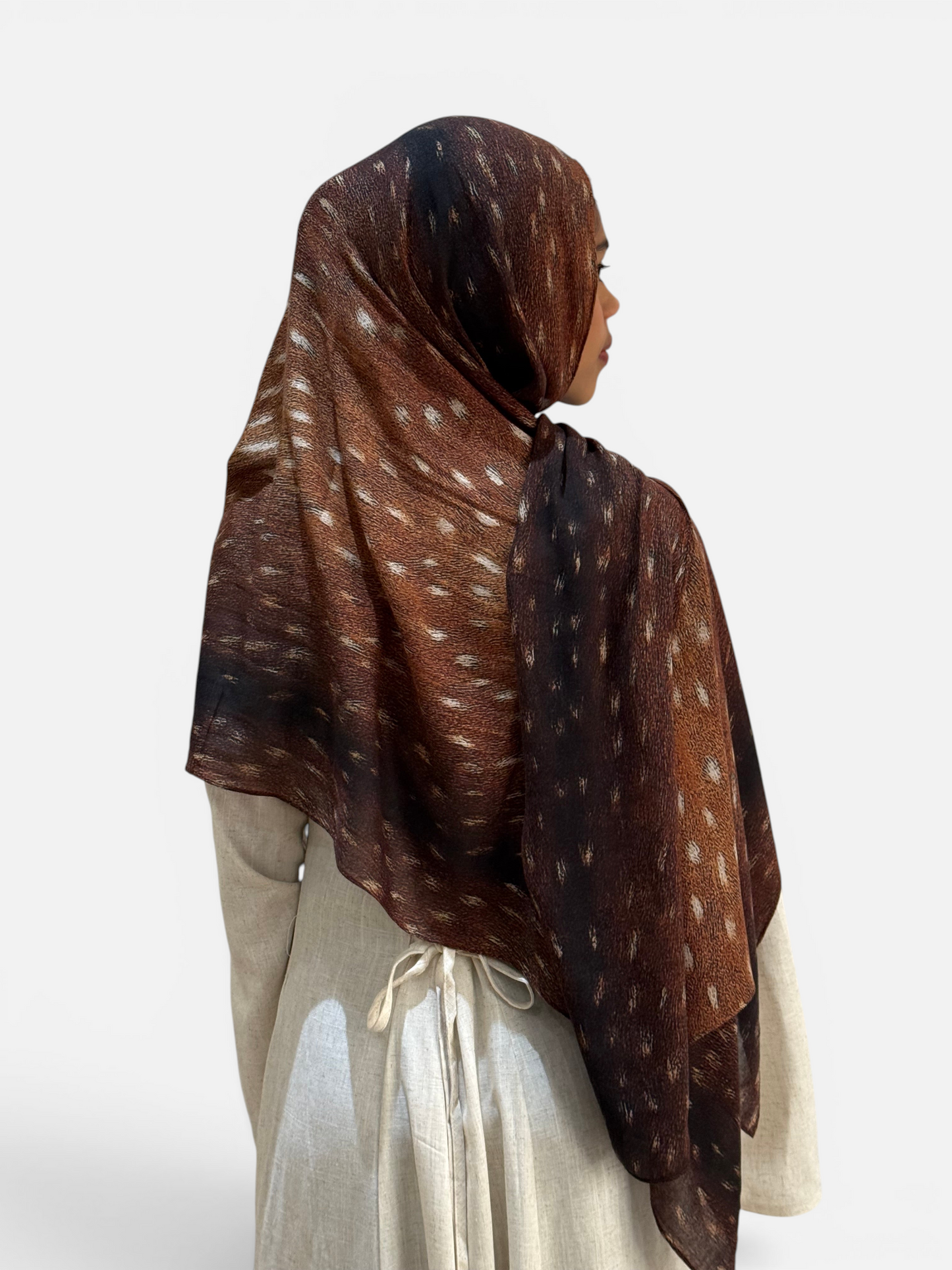 SAHR STUDIOS Premium Modal Bambi scarf in brown with white spots, worn by a model in a light beige dress.