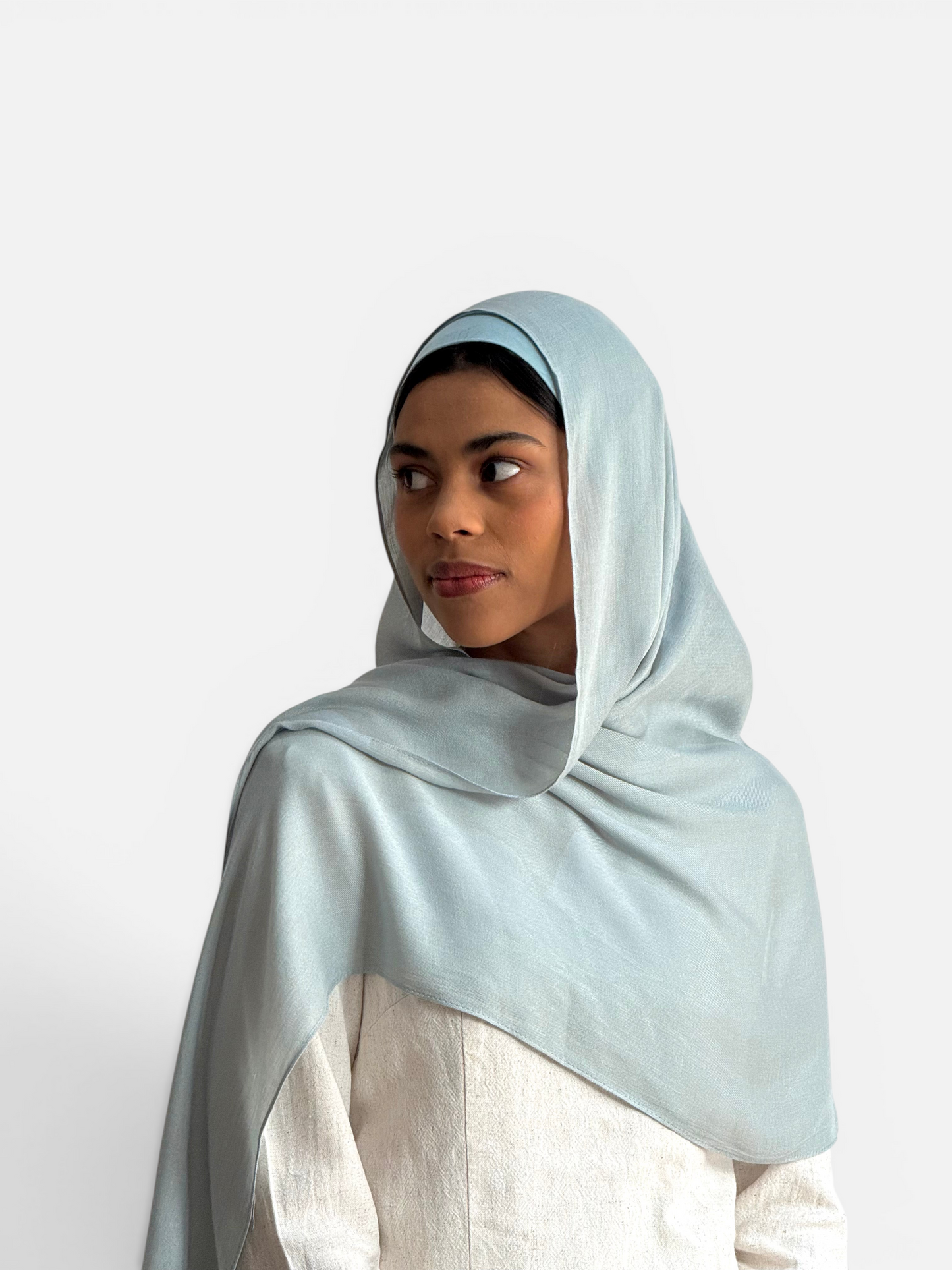 SAHR STUDIOS seashell blue modal hijab scarf and matching undercap worn by a model with a soft, breathable drape.